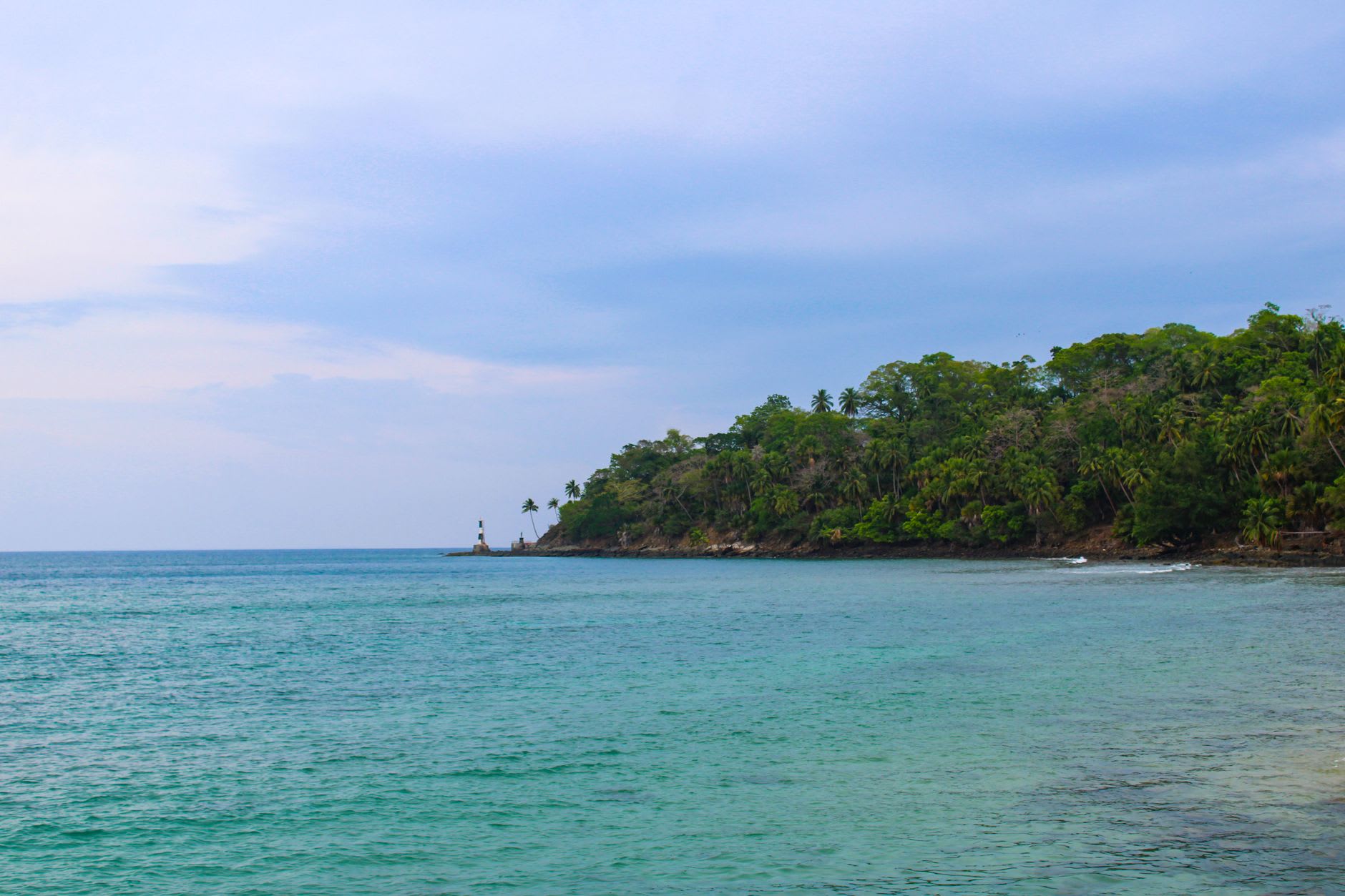 Radhanagar Beach at late afternoon with turquoise water reflecting the last of the golden light