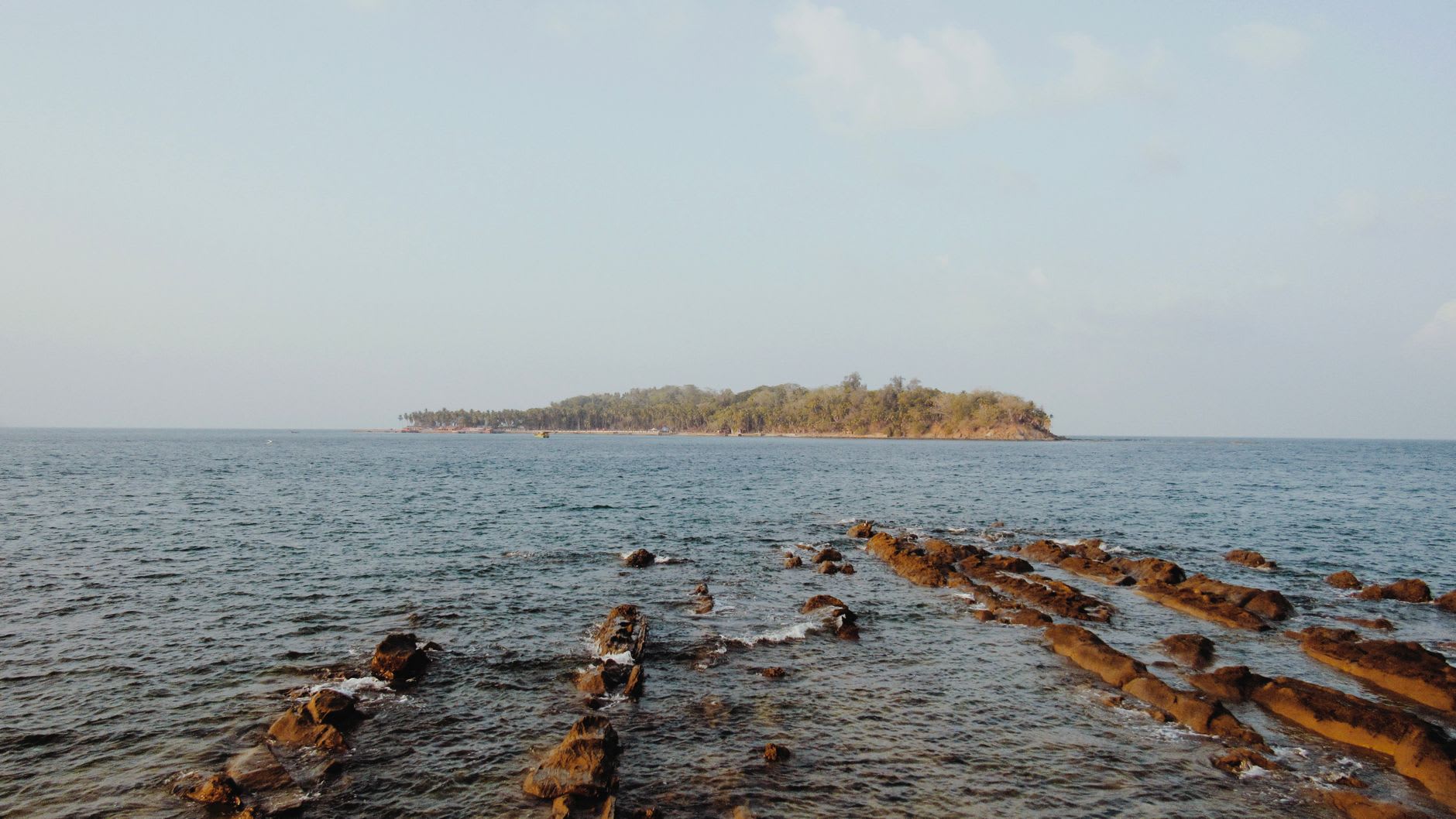 The natural rock arch at Laxmanpur Beach glowing in the last light of the day