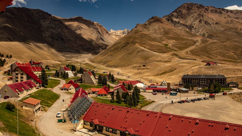 Ski resort village of Las Leñas with hotels clustered at the base of snow-covered Andean peaks