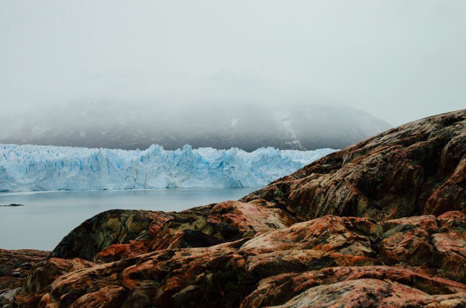 The massive blue ice face of Perito Moreno Glacier calving into Lago Argentino