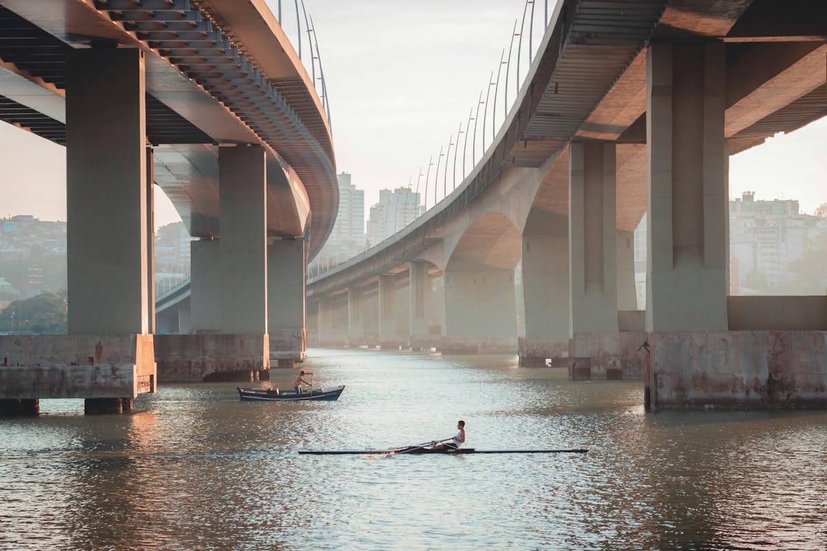 Rowers gliding along the calm morning waters of the Tigre River