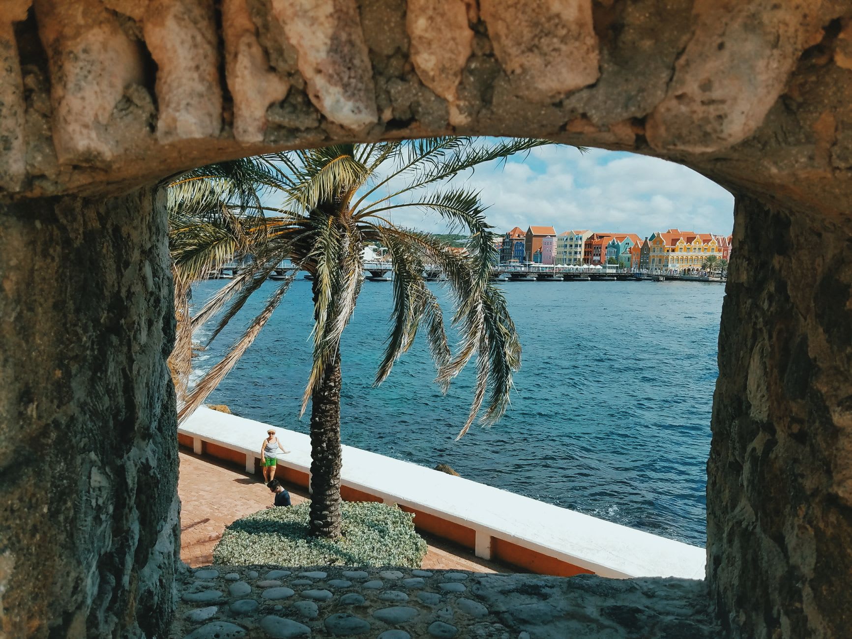 Fort Zoutman's coral stone walls in central Oranjestad surrounded by bougainvillea