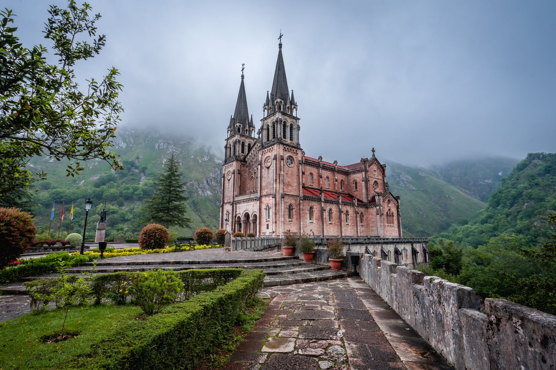 The sacred cave of Covadonga with its waterfall and the Virgin's shrine set into the rock face