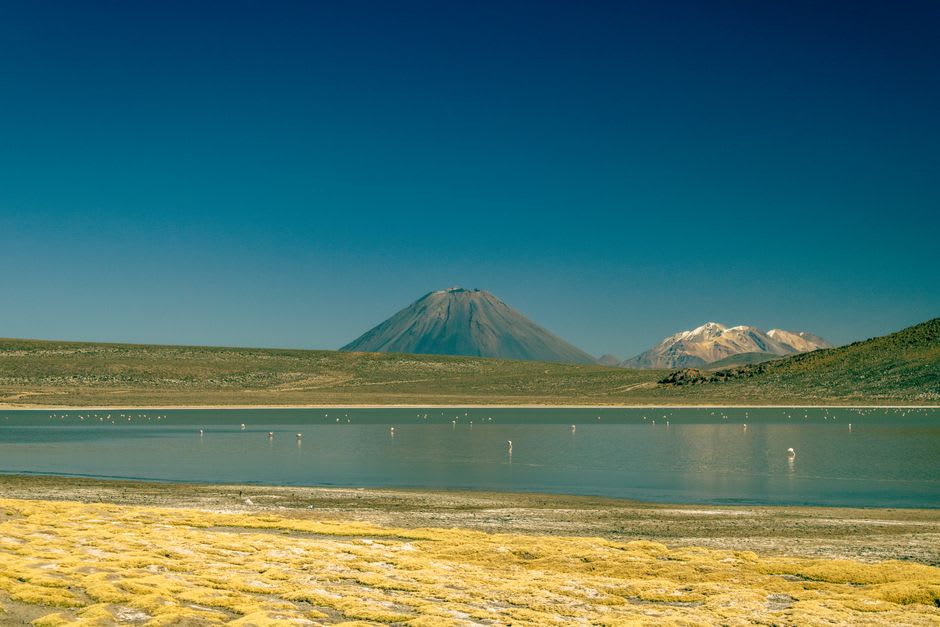 Laguna Cejar at sunset with Licancabur volcano glowing in the background
