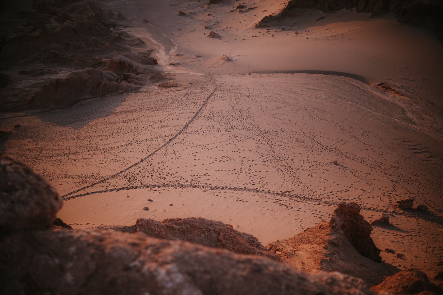The great dune of Valle de la Luna with Licancabur volcano rising perfect and dark on the horizon