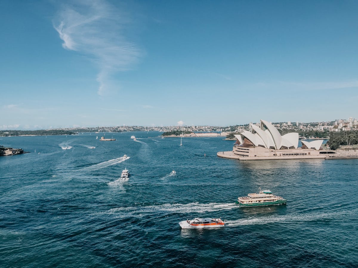 Sydney Opera House sails gleaming against the harbour