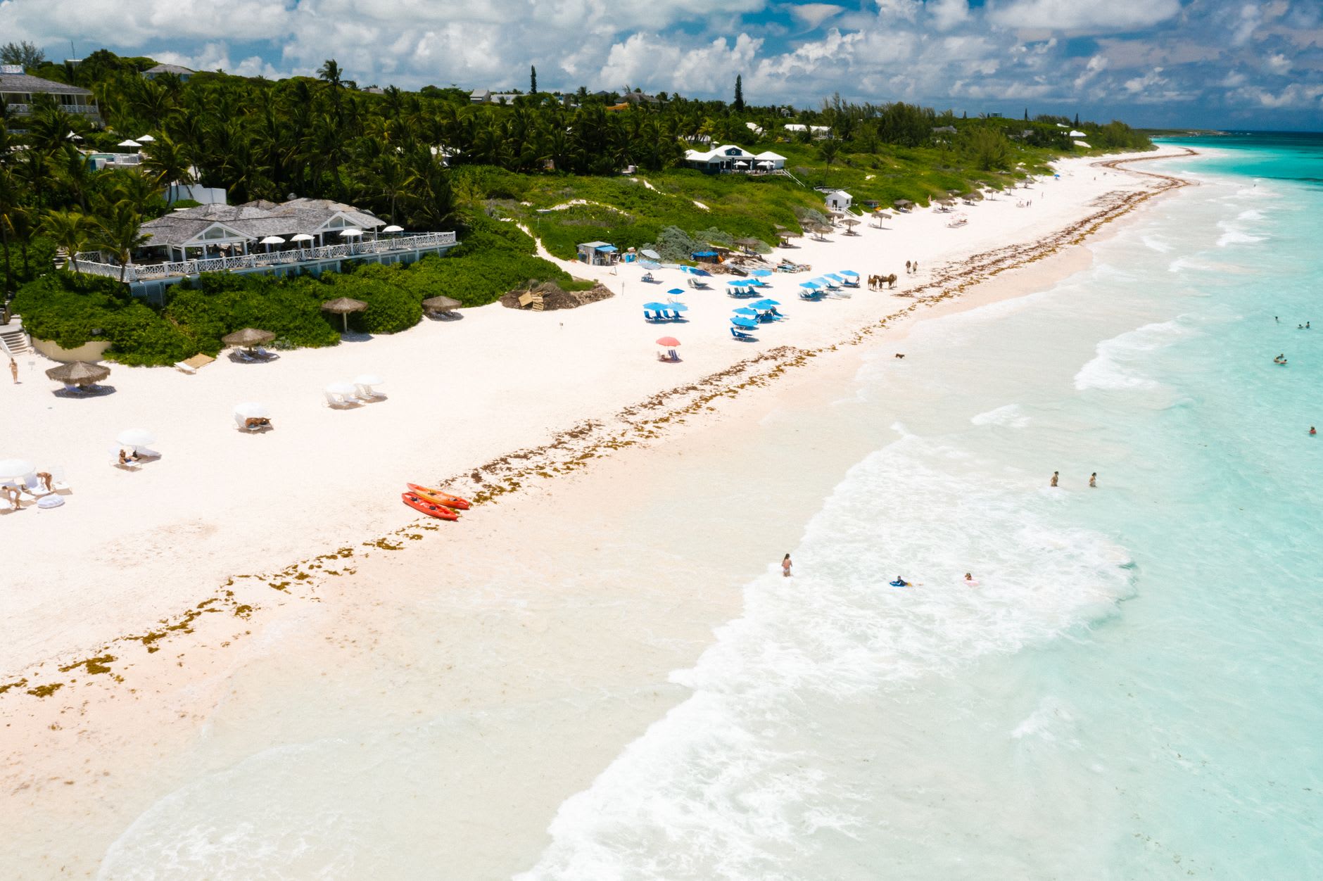 The pink sand beach at Harbour Island stretching north in clear afternoon light