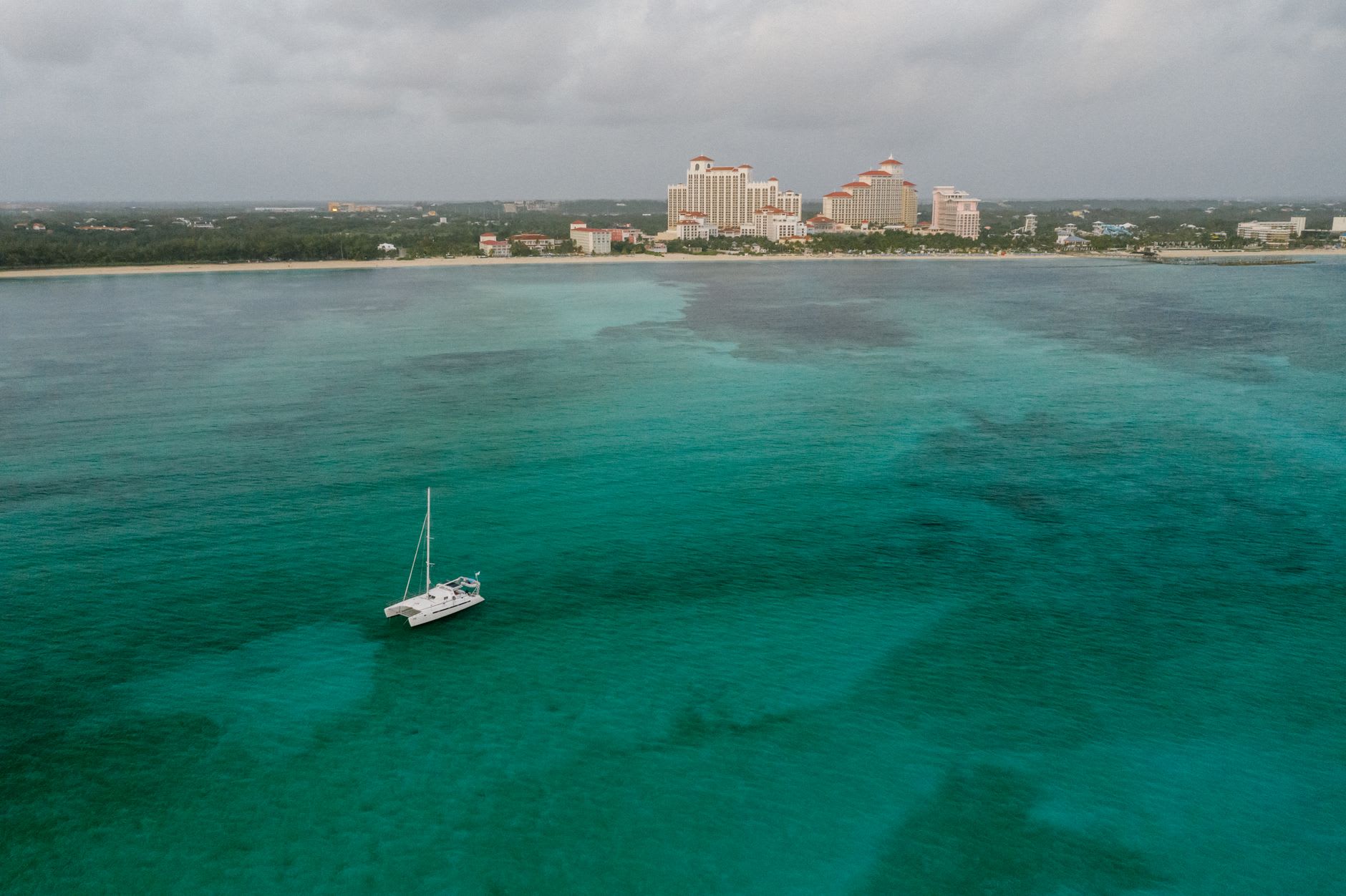 Morton Salt's windmill pumps and salt crystallization ponds on Inagua, producing a surreal white and blue industrial landscape