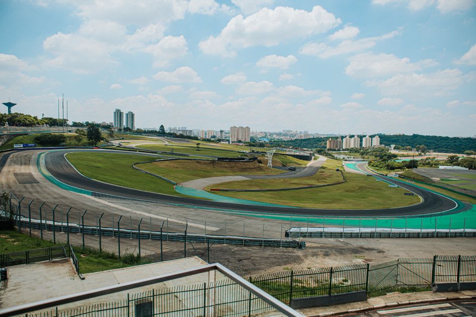 Aerial view of the Bahrain International Circuit's main straight and grandstands surrounded by open Sakhir desert