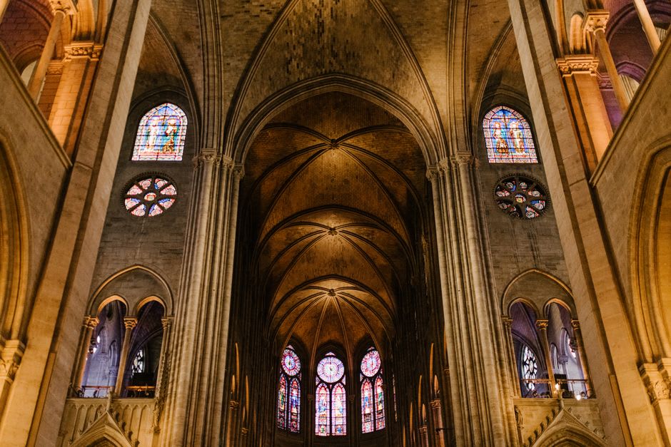 The interior of the prefabricated iron Iglesia Santa Bárbara in Santa Rosalía showing riveted metal walls and wooden pews
