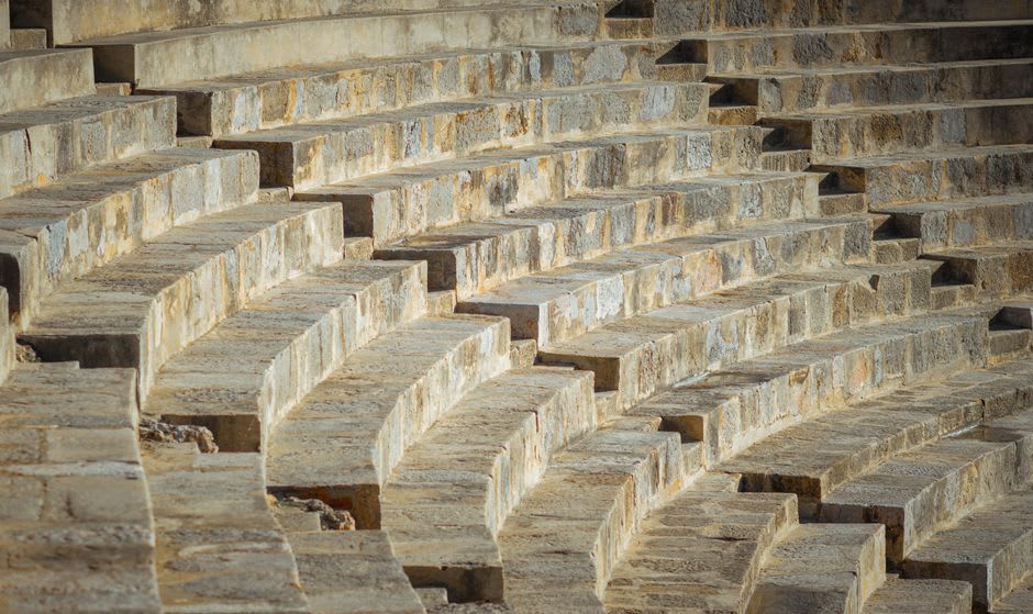 The excavated Roman amphitheater of Pollentia outside Alcúdia's walls in late afternoon light
