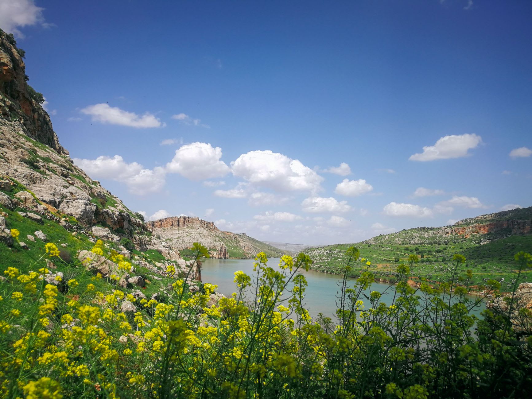 The Qaraoun Dam, concrete across the Litani River, with the lake stretching behind it into the mountain landscape