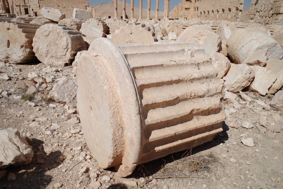 A massive half-carved column drum lying abandoned in the ancient Roman quarry near Majdal Anjar