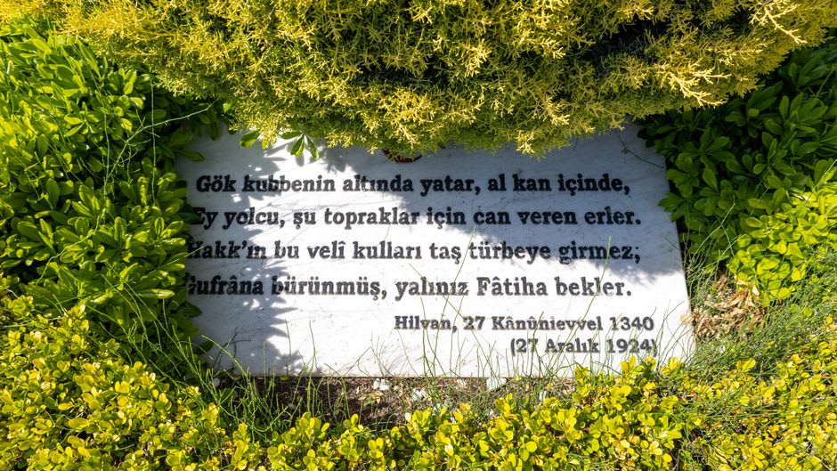 Detail of an inscribed plaque marking where a family's house once stood in the village of Khatyn