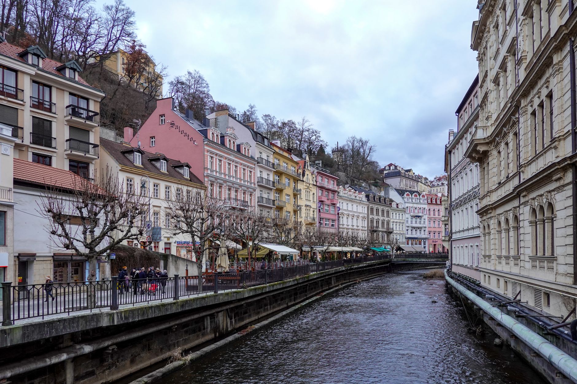 The Russian Orthodox Church of Saints Peter and Paul in Karlovy Vary glowing at dusk, its golden domes catching the last light