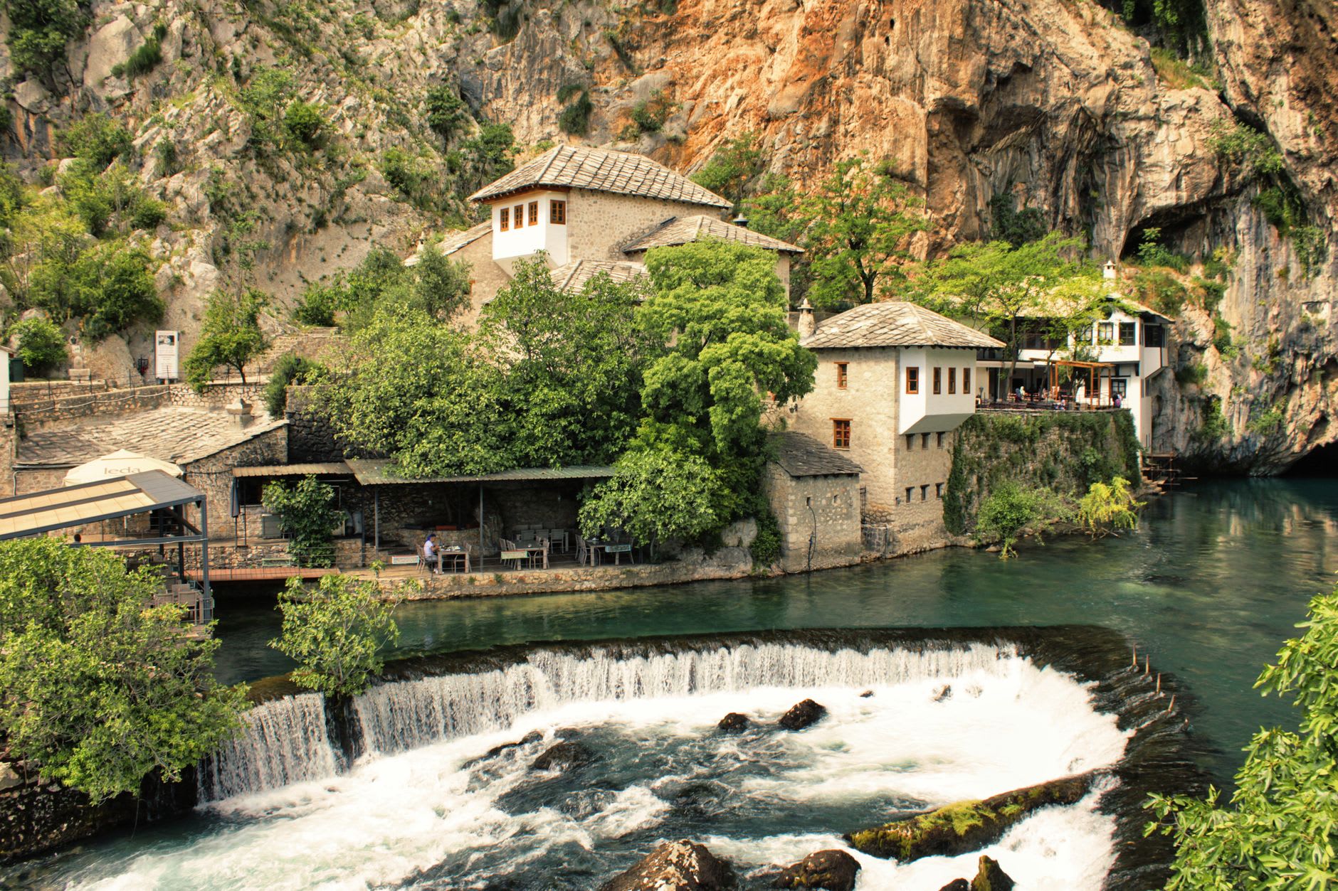Stone houses with Ottoman wooden balconies along the narrow lanes of Blagaj village above the river
