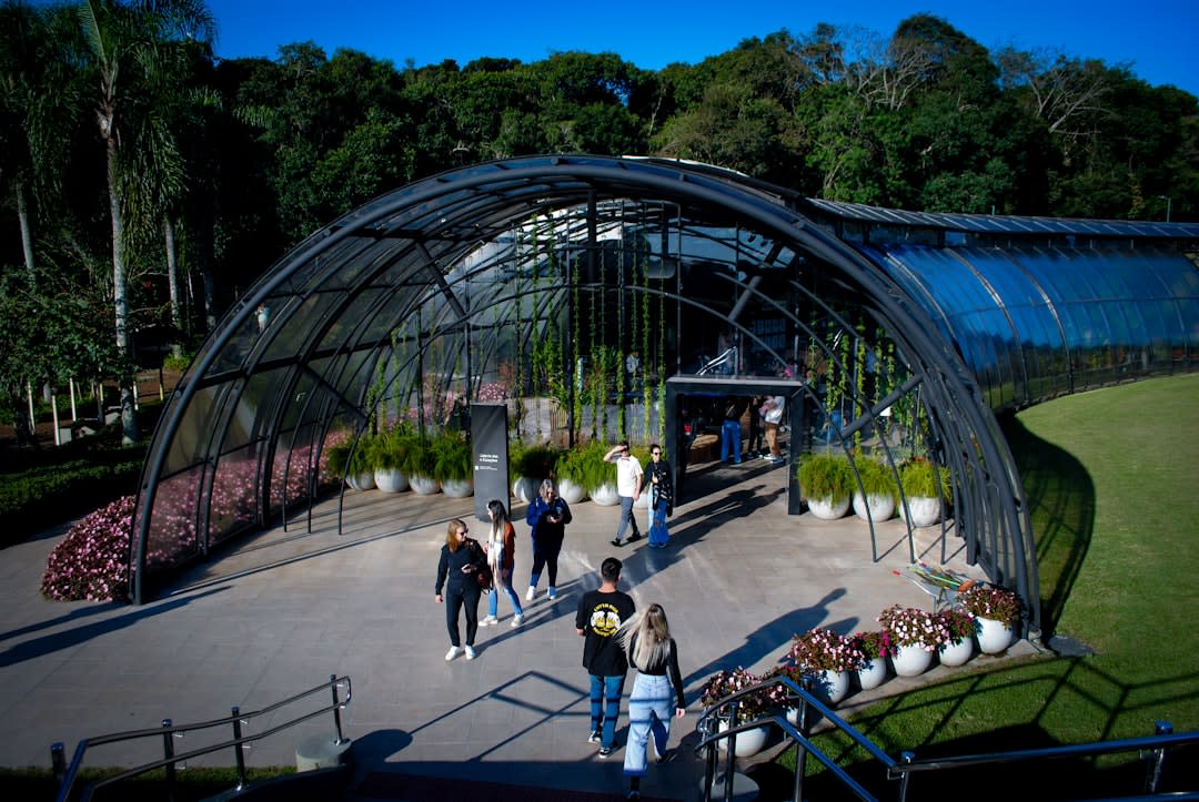 Curitiba's glass botanical garden conservatory glowing in morning light