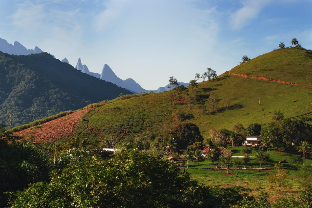 A wide valley view from a lookout point above Jacobina showing farmland and distant hills