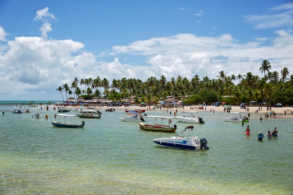 Turquoise water and palm-lined sand at Terceira Praia in Morro de São Paulo