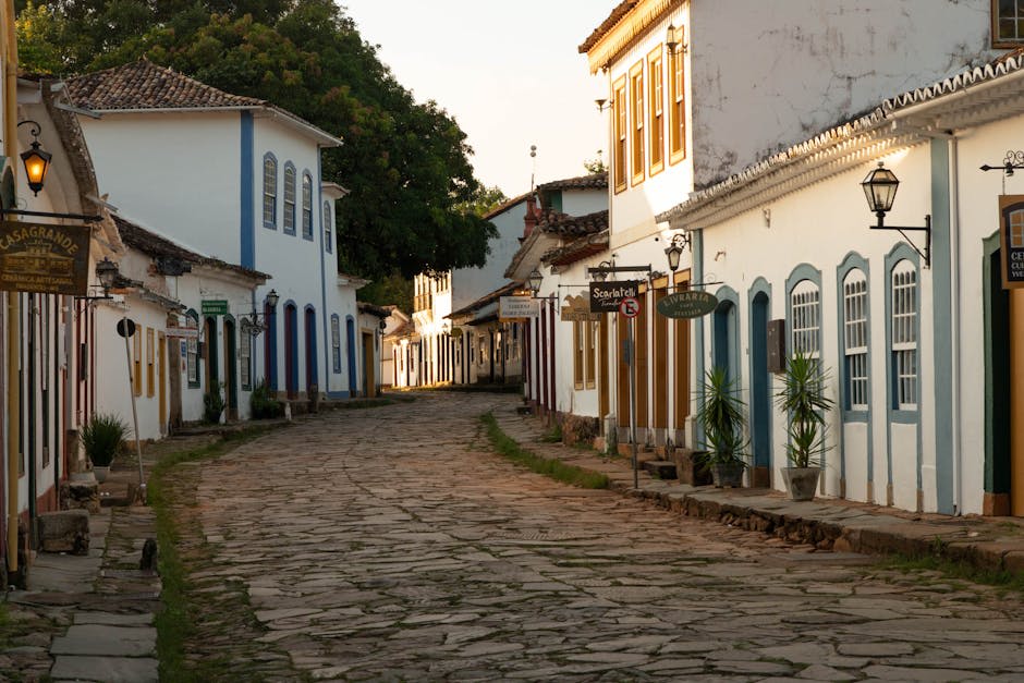 Traditional fishing boats moored in Paraty's harbour with mountains behind