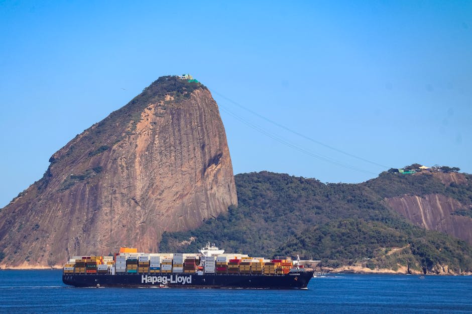 Copacabana beach stretching toward Sugarloaf Mountain at golden hour