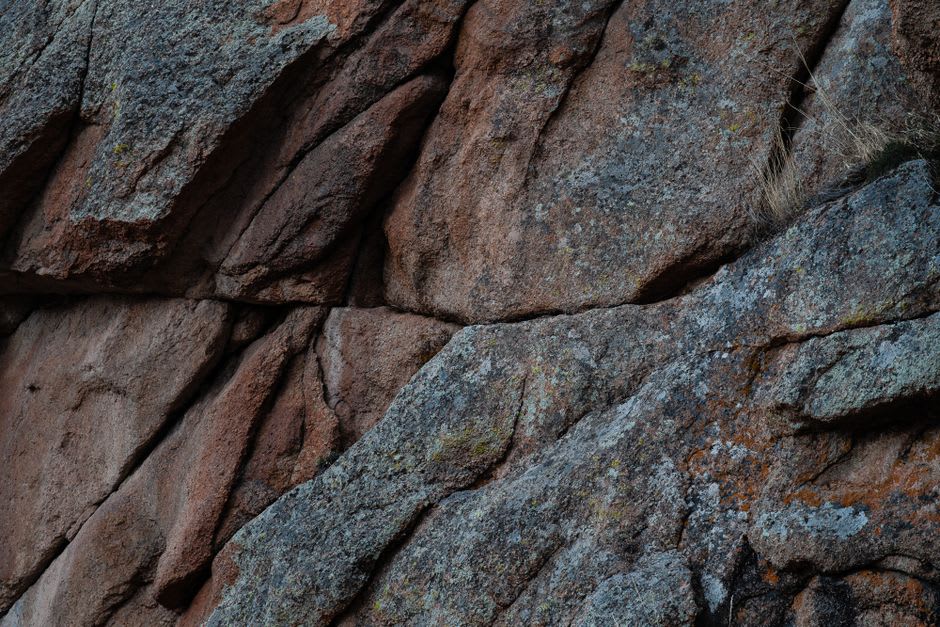 Weathered granite outcrop rising from the savanna plains inside Deux Balés National Park