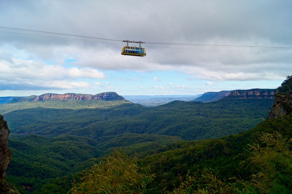 Cable car descending the forested escarpment toward the cave entrance at Ubajara