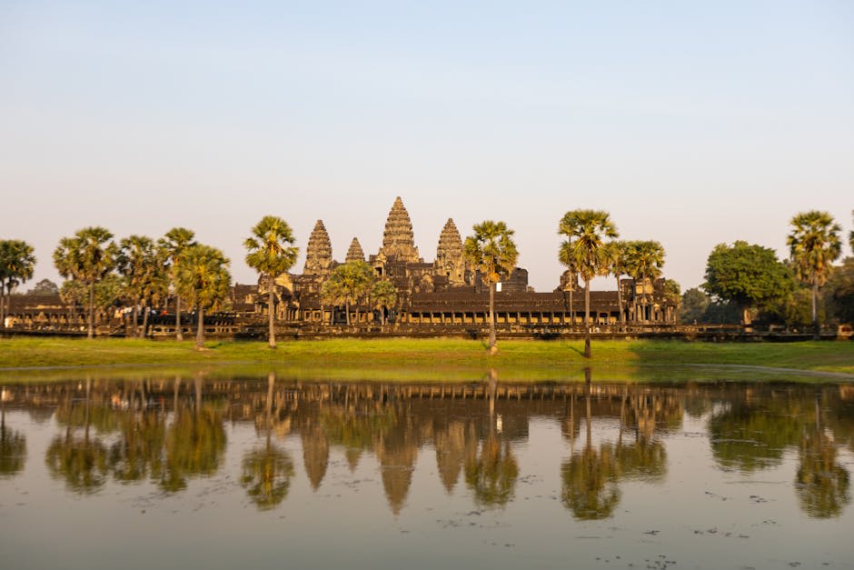 Weathered stone faces of Bayon temple in soft afternoon light