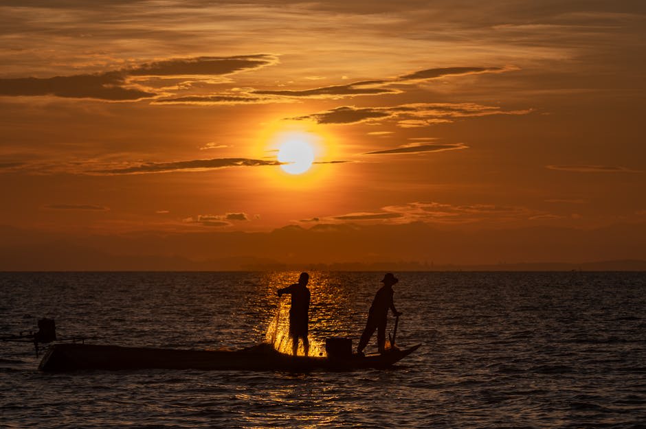 Calm coastal waters and green hills surrounding the town of Kep