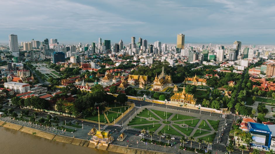 Golden spires of the Royal Palace rising above Phnom Penh's riverfront