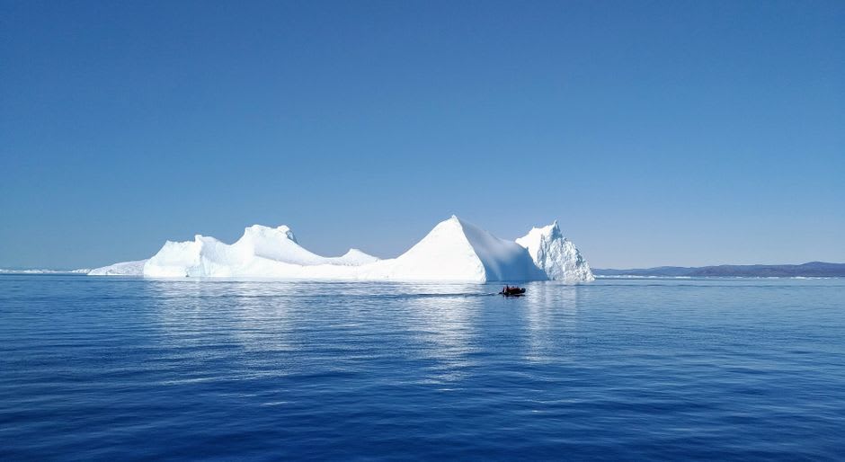 Massive blue-white iceberg floating near Qikiqtarjuaq off the coast of Baffin Island