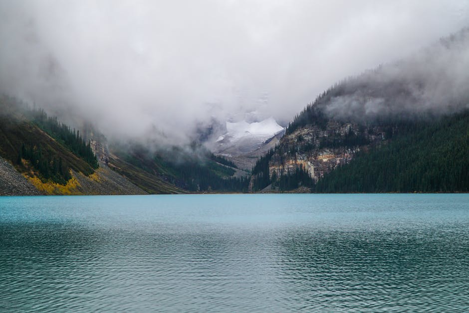 Mountain highway winding through alpine valleys with glacial peaks