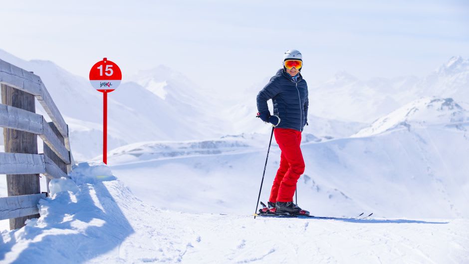 Skier carving down a groomed run at Blue Mountain resort