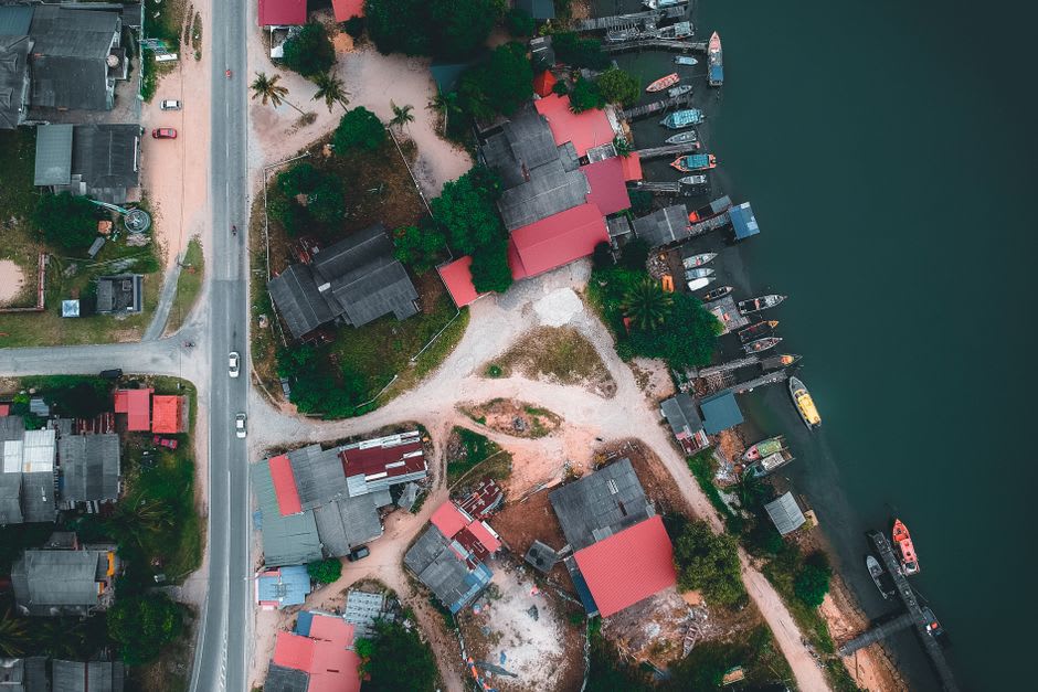Colorful fishing village houses along the coastal road of Cape Breton Island