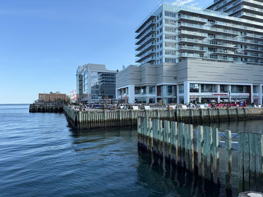 Halifax waterfront boardwalk lined with historic buildings and harbour boats
