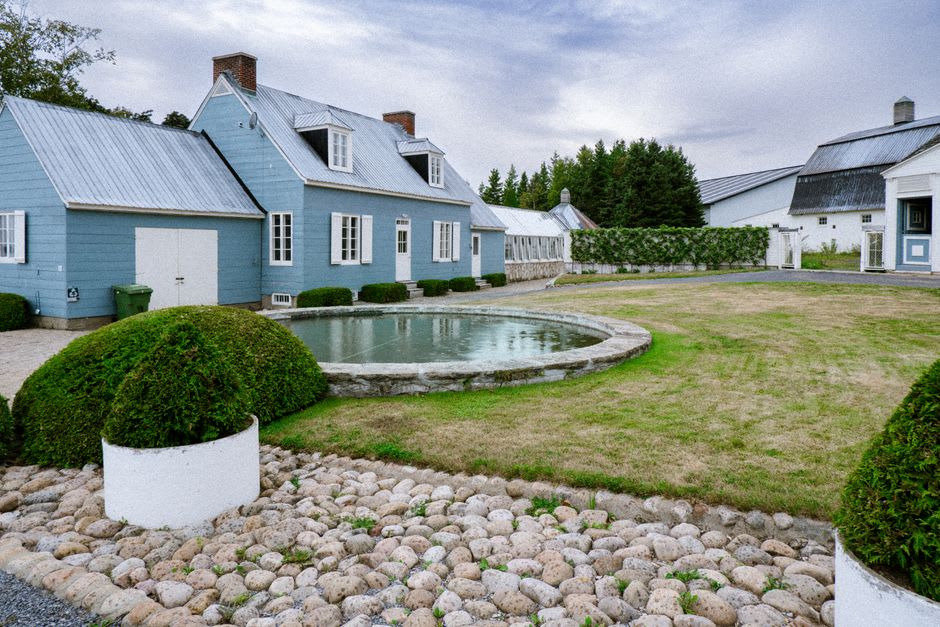 Traditional stone Quebec farmhouse with a steep roof on Île d'Orléans