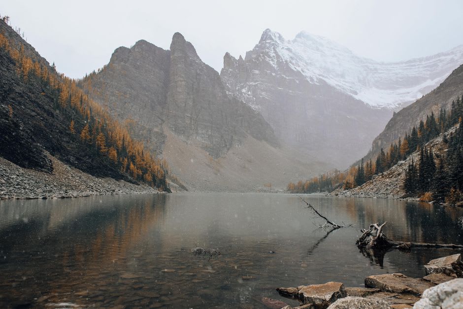 Hikers on the trail approaching the historic Lake Agnes Tea House above Lake Louise