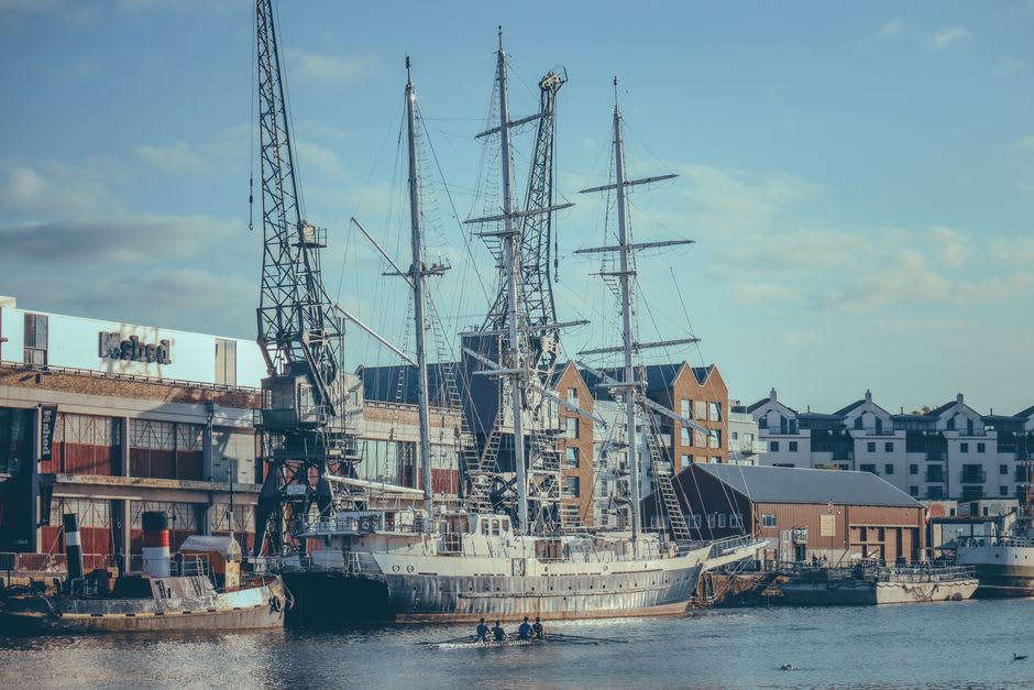 Historic Lunenburg harbourfront with the Bluenose II schooner docked among colorful buildings