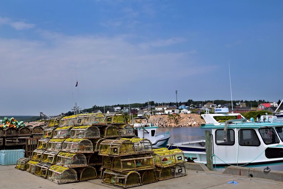 Small fishing village harbour with lobster boats at Peggy's Cove