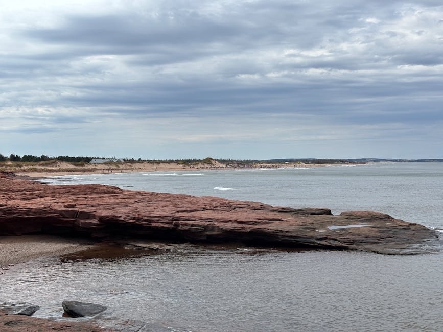 A quiet PEI harbour with colourful fishing boats at rest