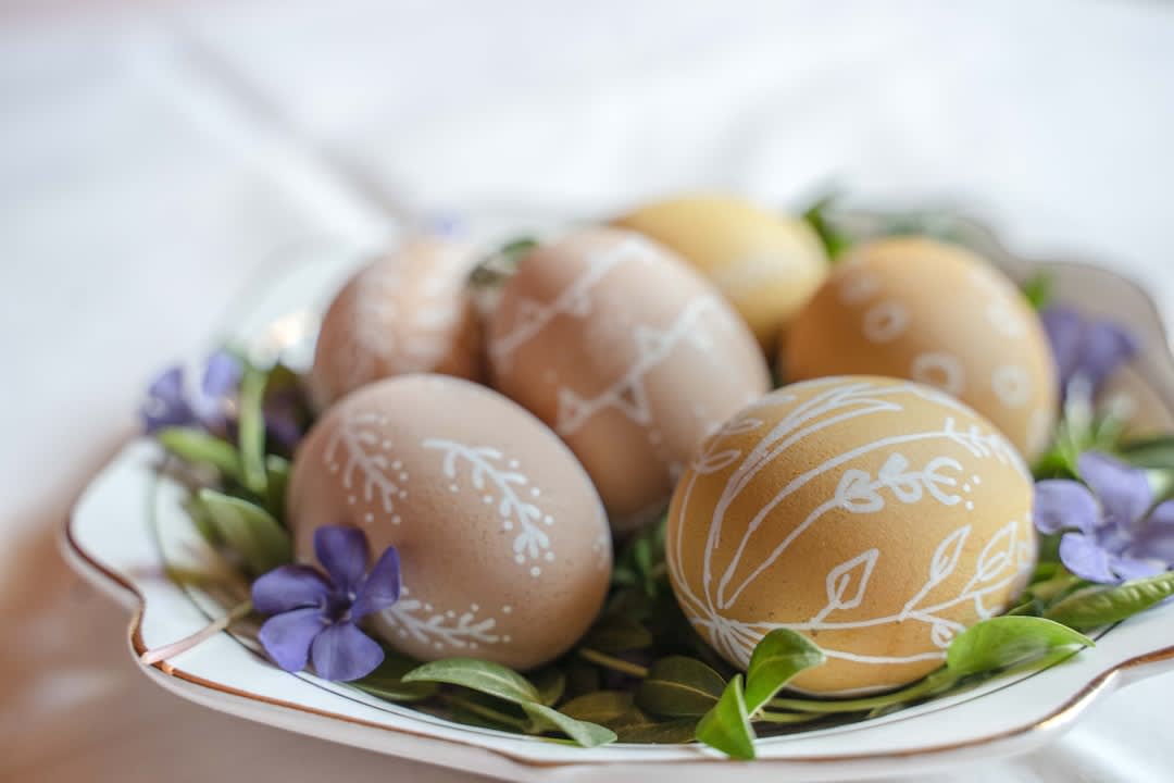 Roadside honesty stall selling fresh eggs and flowers with a jar for coins