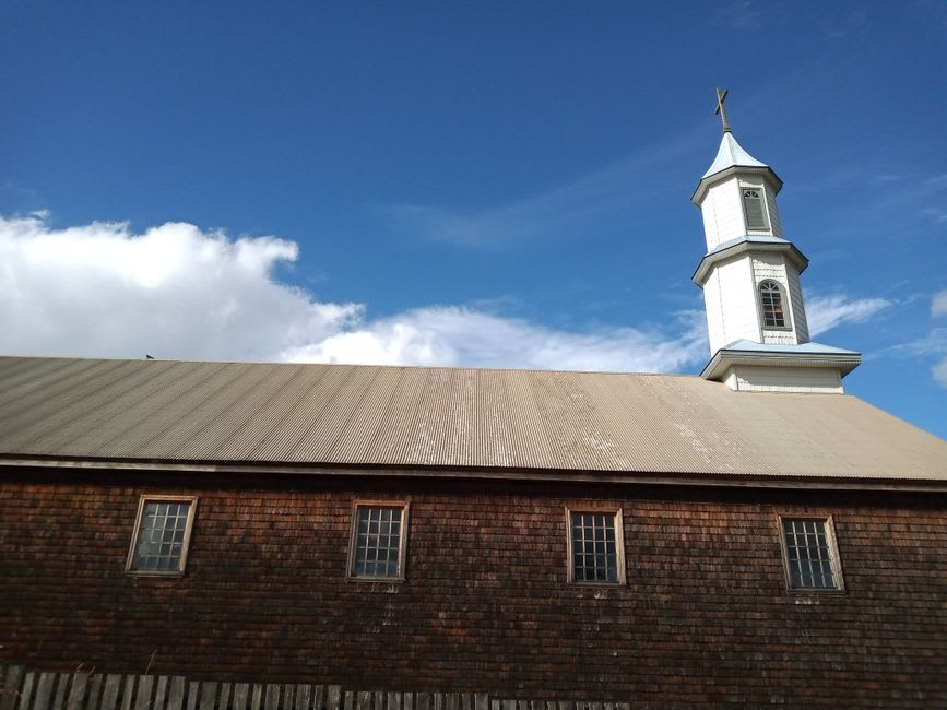 Weathered wooden Chapelle de Tadoussac with its small steeple against the sky
