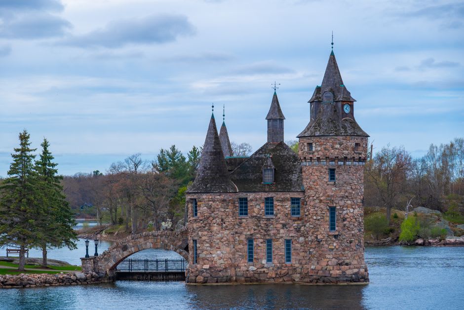 Grand stone turrets of Boldt Castle rising from a small island on the St. Lawrence River
