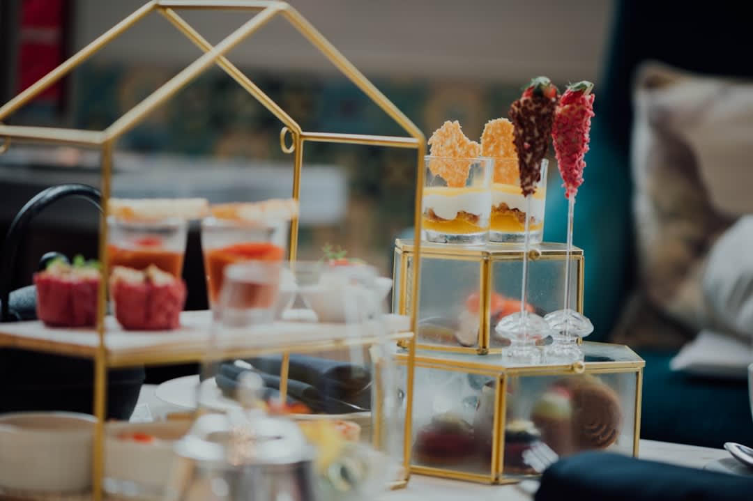 Afternoon tea service with tiered stands at a grand harbourside hotel