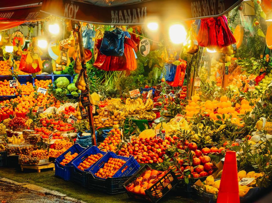 Wooden crates of citrus fruit stacked inside a cool, naturally refrigerated storage cave beneath the town of Ortahisar