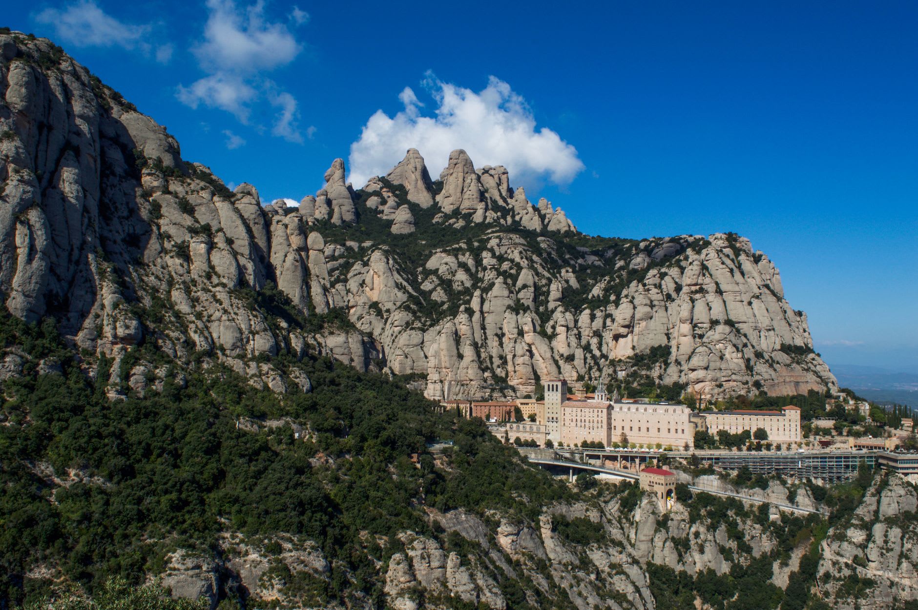 The rack railway ascending the steep flank of Montserrat, with the Catalan plain spread out below