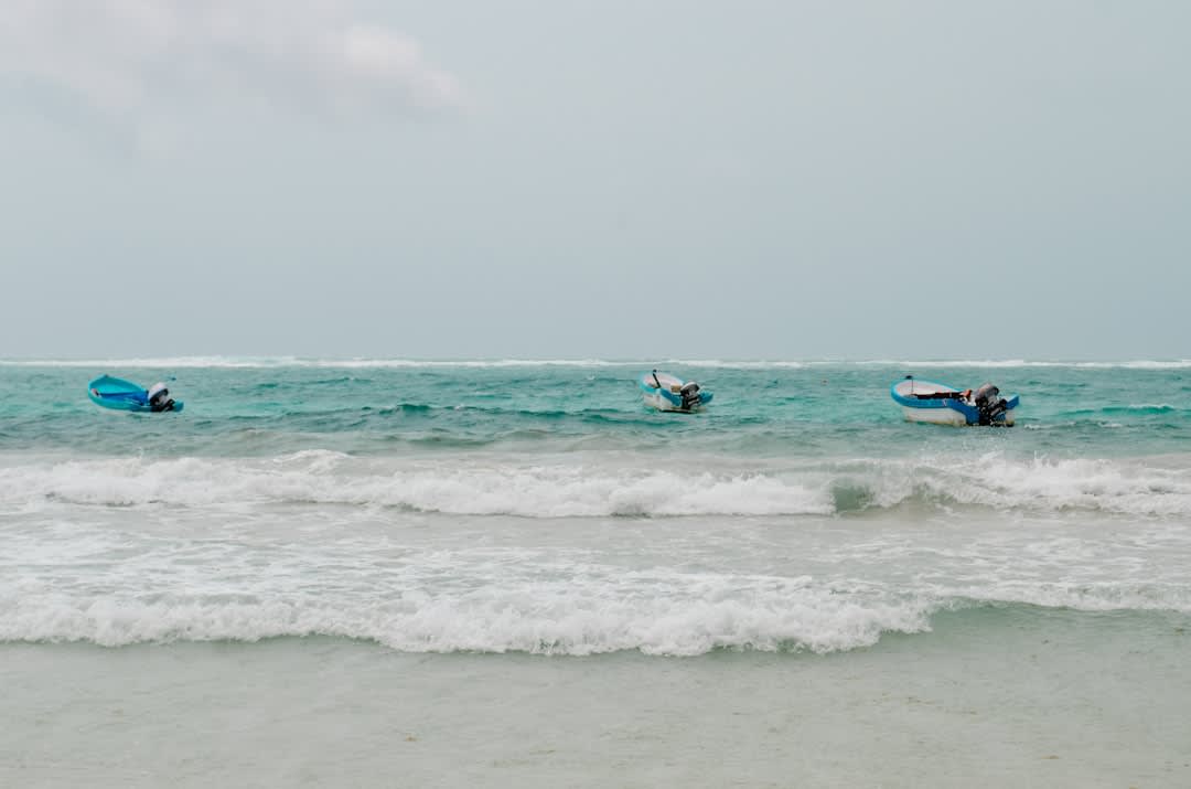 Pierre and Lia wading through the calm shallow water of Starfish Point, Grand Cayman