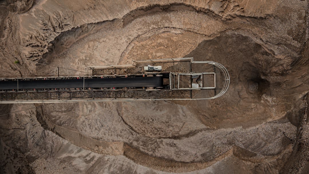 Artisanal diamond miners sieving gravel by hand at a riverbed near Carnot