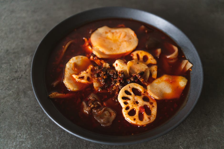 A bubbling Sichuan hotpot spread with ingredients