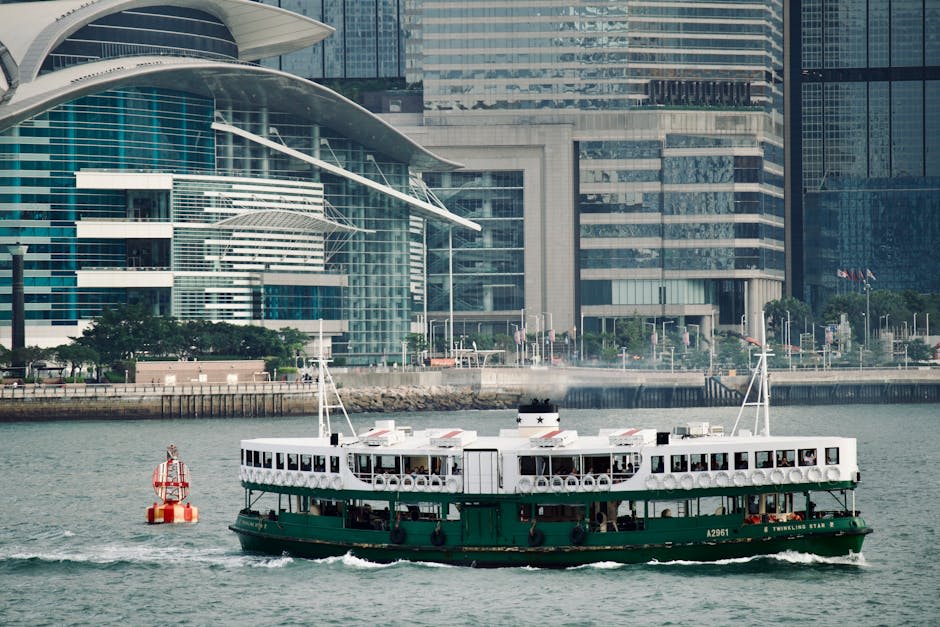The Star Ferry crossing Victoria Harbour with skyline behind